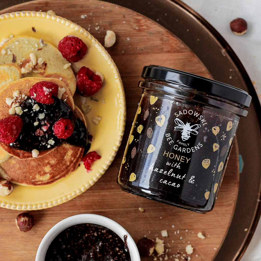 Glass jar of cocoa hazelnut multiflower honey with hazelnuts – Honey & Bloom Singapore