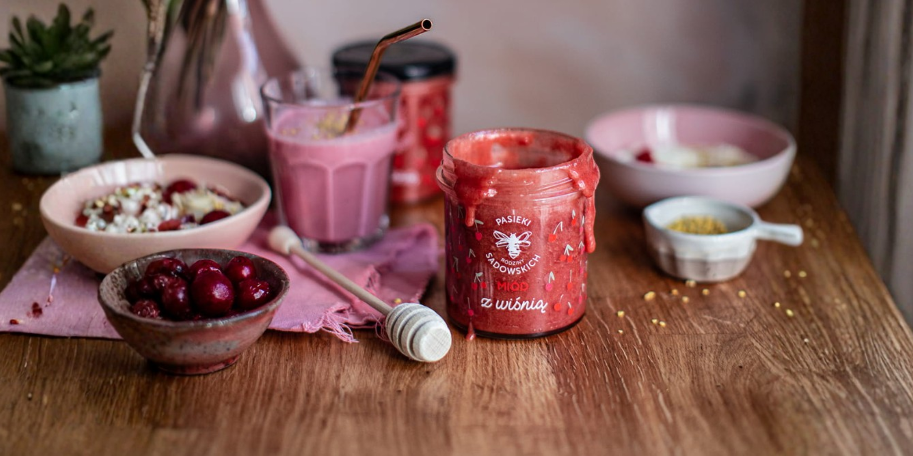Jar of artisan honey with breakfast foods, linking to a doctor-written article about the health benefits of honey